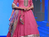 A model walks the ramp showcasing a designer collection during the 'Shaadiyan' season-5 fashion show in Jaipur, Rajasthan, India, on October...