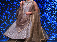 A model walks the ramp showcasing a designer collection during the 'Shaadiyan' season-5 fashion show in Jaipur, Rajasthan, India, on October...