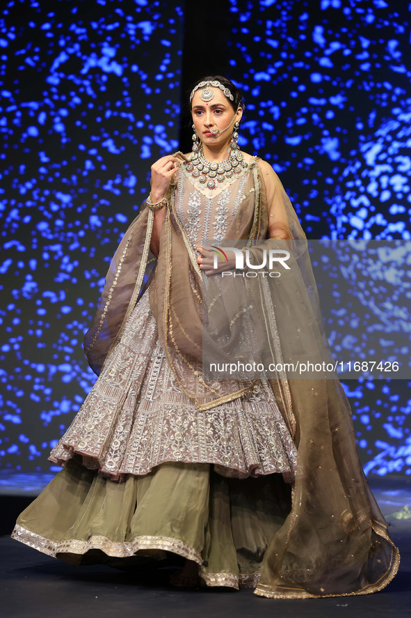 A model walks the ramp showcasing a designer collection during the 'Shaadiyan' season-5 fashion show in Jaipur, Rajasthan, India, on October...