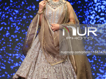 A model walks the ramp showcasing a designer collection during the 'Shaadiyan' season-5 fashion show in Jaipur, Rajasthan, India, on October...