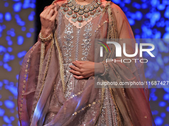 A model walks the ramp showcasing a designer collection during the 'Shaadiyan' season-5 fashion show in Jaipur, Rajasthan, India, on October...