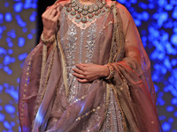 A model walks the ramp showcasing a designer collection during the 'Shaadiyan' season-5 fashion show in Jaipur, Rajasthan, India, on October...