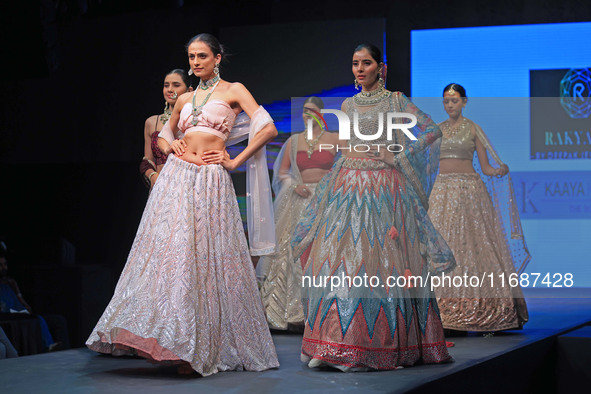 Models walk the ramp showcasing a designer collection during the 'Shaadiyan' season-5 fashion show in Jaipur, Rajasthan, India, on October 1...