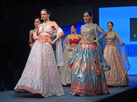 Models walk the ramp showcasing a designer collection during the 'Shaadiyan' season-5 fashion show in Jaipur, Rajasthan, India, on October 1...