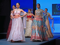 Models walk the ramp showcasing a designer collection during the 'Shaadiyan' season-5 fashion show in Jaipur, Rajasthan, India, on October 1...