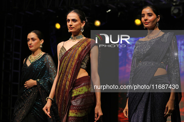 Models walk the ramp showcasing a designer collection during the 'Shaadiyan' season-5 fashion show in Jaipur, Rajasthan, India, on October 1...