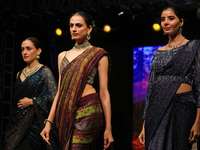 Models walk the ramp showcasing a designer collection during the 'Shaadiyan' season-5 fashion show in Jaipur, Rajasthan, India, on October 1...