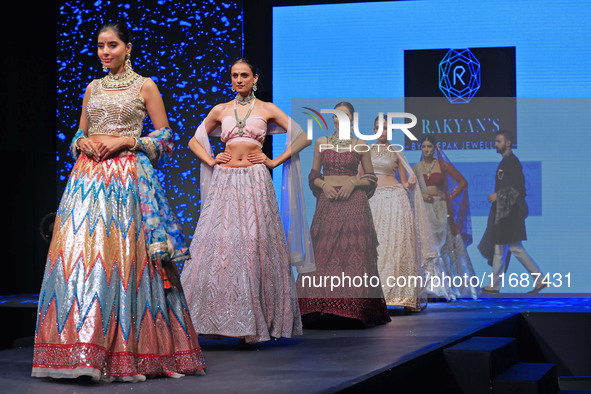 Models walk the ramp showcasing a designer collection during the 'Shaadiyan' season-5 fashion show in Jaipur, Rajasthan, India, on October 1...