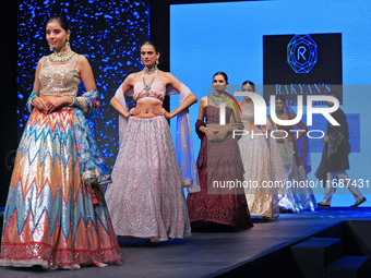 Models walk the ramp showcasing a designer collection during the 'Shaadiyan' season-5 fashion show in Jaipur, Rajasthan, India, on October 1...