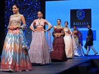 Models walk the ramp showcasing a designer collection during the 'Shaadiyan' season-5 fashion show in Jaipur, Rajasthan, India, on October 1...