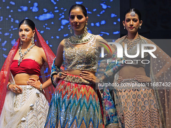 Models walk the ramp showcasing a designer collection during the 'Shaadiyan' season-5 fashion show in Jaipur, Rajasthan, India, on October 1...