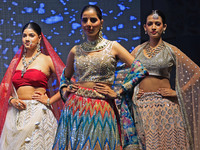 Models walk the ramp showcasing a designer collection during the 'Shaadiyan' season-5 fashion show in Jaipur, Rajasthan, India, on October 1...