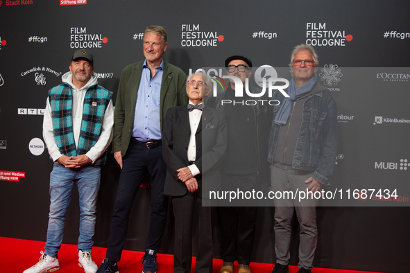 Dr. Leon Weintraub, the Holocaust survivor, Michael Souvignier, the producer of the film, and film crews are on the red carpet of the photoc...