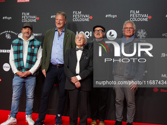 Dr. Leon Weintraub, the Holocaust survivor, Michael Souvignier, the producer of the film, and film crews are on the red carpet of the photoc...