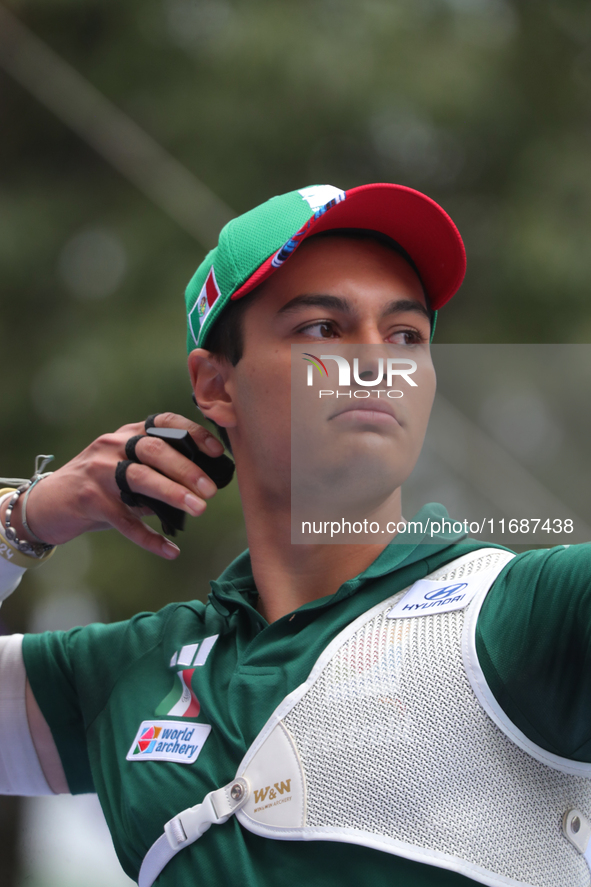 Matias Grande of Mexico competes against Kim Woojin of Korea (not in picture) during the Men's recurve semifinals match on the final day of...