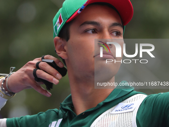 Matias Grande of Mexico competes against Kim Woojin of Korea (not in picture) during the Men's recurve semifinals match on the final day of...