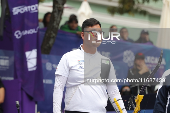 Kim Woojin of Korea competes against Matias Grande of Mexico (not in picture) during the Men's recurve semifinals match on the final day of...