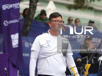 Kim Woojin of Korea competes against Matias Grande of Mexico (not in picture) during the Men's recurve semifinals match on the final day of...