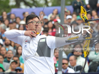 Kim Woojin of Korea competes against Matias Grande of Mexico (not in picture) during the Men's recurve semifinals match on the final day of...