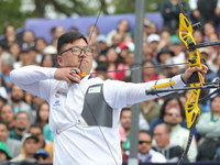 Kim Woojin of Korea competes against Matias Grande of Mexico (not in picture) during the Men's recurve semifinals match on the final day of...