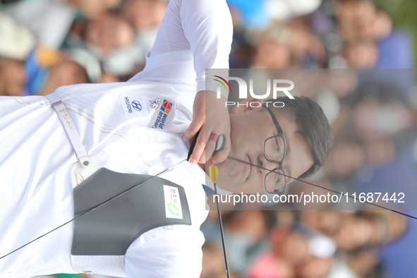 Kim Woojin of Korea competes against Matias Grande of Mexico (not in picture) during the Men's recurve semifinals match on the final day of...