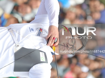 Kim Woojin of Korea competes against Matias Grande of Mexico (not in picture) during the Men's recurve semifinals match on the final day of...