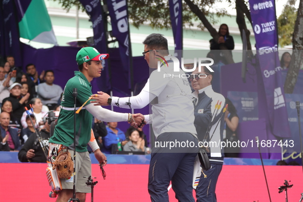 Kim Woojin of Korea and Matias Grande of Mexico compete during the Men's recurve semifinals match on the final day of the Tlaxcala 2024 Arch...