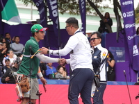 Kim Woojin of Korea and Matias Grande of Mexico compete during the Men's recurve semifinals match on the final day of the Tlaxcala 2024 Arch...