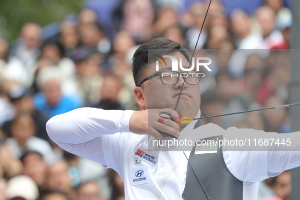 Kim Woojin of Korea competes against Matias Grande of Mexico (not in picture) during the Men's recurve semifinals match on the final day of...