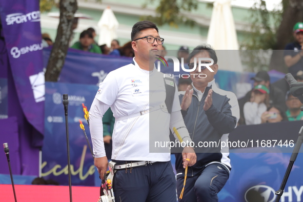 Kim Woojin of Korea competes against Matias Grande of Mexico (not in picture) during the Men's recurve semifinals match on the final day of...