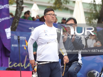 Kim Woojin of Korea competes against Matias Grande of Mexico (not in picture) during the Men's recurve semifinals match on the final day of...