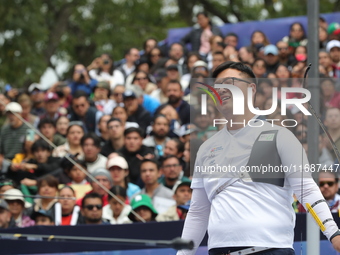 Kim Woojin of Korea competes against Matias Grande of Mexico (not in picture) during the Men's recurve semifinals match on the final day of...