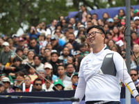 Kim Woojin of Korea competes against Matias Grande of Mexico (not in picture) during the Men's recurve semifinals match on the final day of...