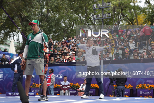 Kim Woojin of Korea and Matias Grande of Mexico compete during the Men's recurve semifinals match on the final day of the Tlaxcala 2024 Arch...