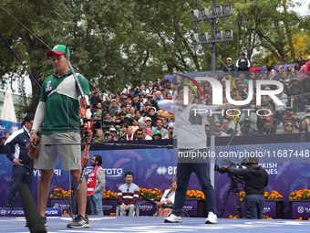 Kim Woojin of Korea and Matias Grande of Mexico compete during the Men's recurve semifinals match on the final day of the Tlaxcala 2024 Arch...