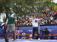 Kim Woojin of Korea and Matias Grande of Mexico compete during the Men's recurve semifinals match on the final day of the Tlaxcala 2024 Arch...