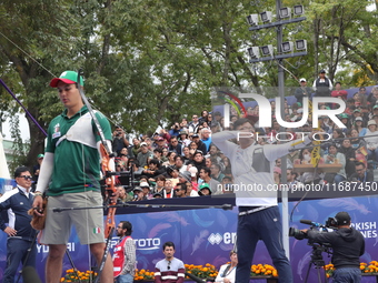 Kim Woojin of Korea and Matias Grande of Mexico compete during the Men's recurve semifinals match on the final day of the Tlaxcala 2024 Arch...