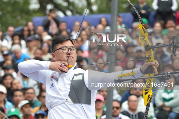 Kim Woojin of Korea competes against Matias Grande of Mexico (not in picture) during the Men's recurve semifinals match on the final day of...