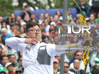 Kim Woojin of Korea competes against Matias Grande of Mexico (not in picture) during the Men's recurve semifinals match on the final day of...