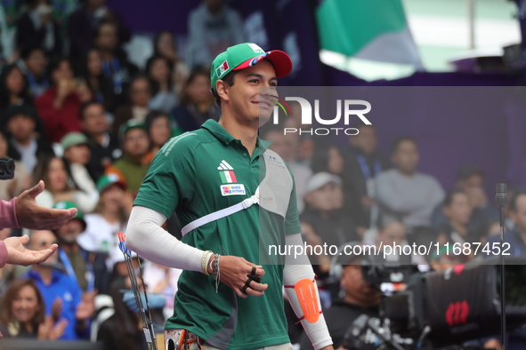 Matias Grande of Mexico competes against Kim Woojin of Korea (not in picture) during the Men's recurve semifinals match on the final day of...