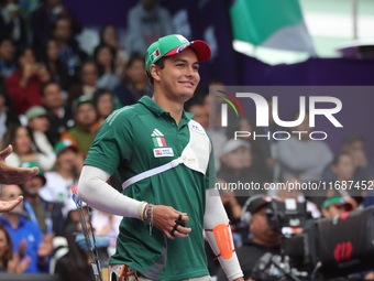 Matias Grande of Mexico competes against Kim Woojin of Korea (not in picture) during the Men's recurve semifinals match on the final day of...