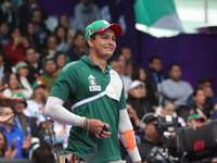 Matias Grande of Mexico competes against Kim Woojin of Korea (not in picture) during the Men's recurve semifinals match on the final day of...