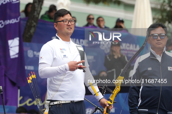 Kim Woojin of Korea competes against Matias Grande of Mexico (not in picture) during the Men's recurve semifinals match on the final day of...