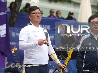 Kim Woojin of Korea competes against Matias Grande of Mexico (not in picture) during the Men's recurve semifinals match on the final day of...