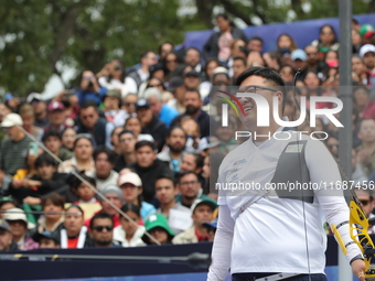 Kim Woojin of Korea competes against Matias Grande of Mexico (not in picture) during the Men's recurve semifinals match on the final day of...