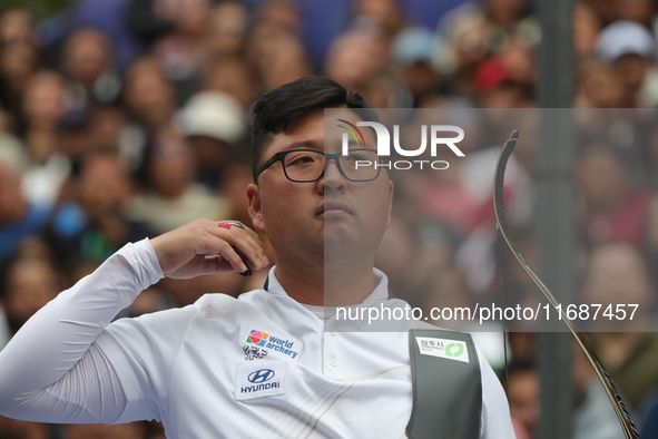 Kim Woojin of Korea competes against Matias Grande of Mexico (not in picture) during the Men's recurve semifinals match on the final day of...