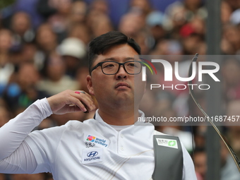 Kim Woojin of Korea competes against Matias Grande of Mexico (not in picture) during the Men's recurve semifinals match on the final day of...