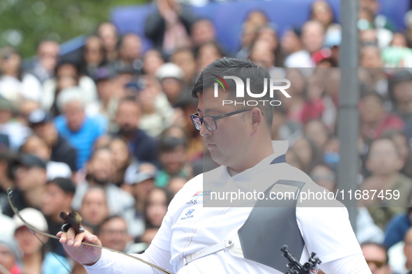 Kim Woojin of Korea competes against Matias Grande of Mexico (not in picture) during the Men's recurve semifinals match on the final day of...