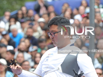 Kim Woojin of Korea competes against Matias Grande of Mexico (not in picture) during the Men's recurve semifinals match on the final day of...