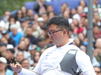 Kim Woojin of Korea competes against Matias Grande of Mexico (not in picture) during the Men's recurve semifinals match on the final day of...